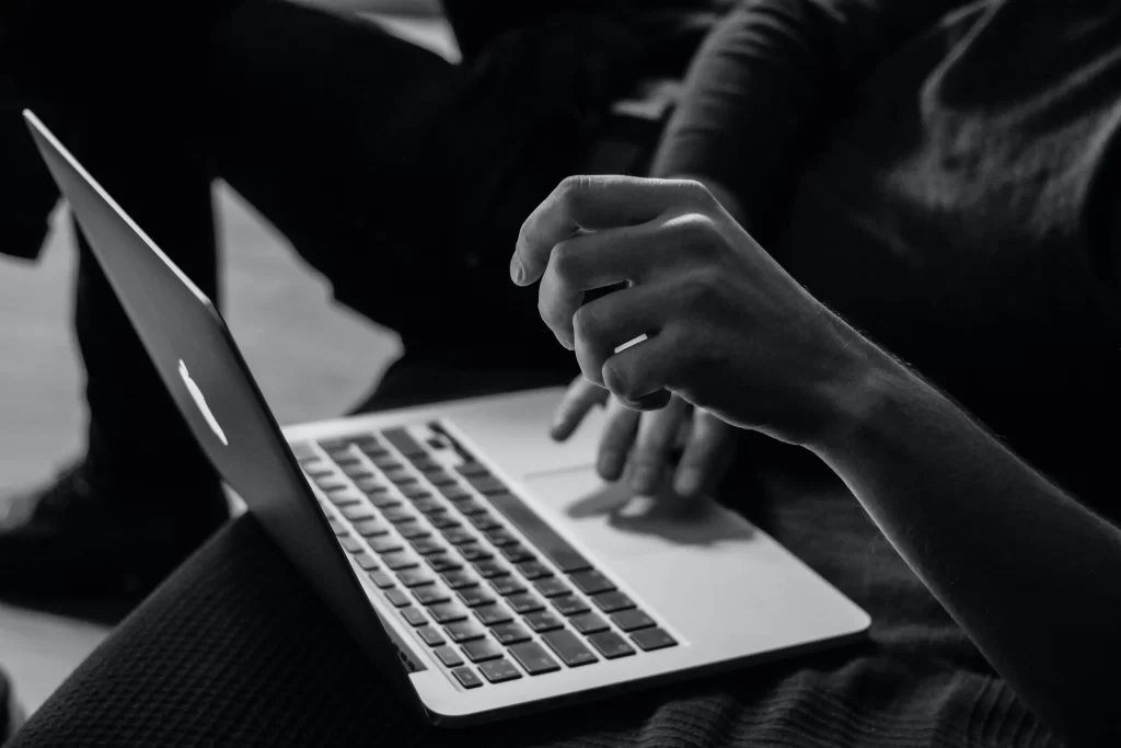 A Person using a Trackpad on MacBook